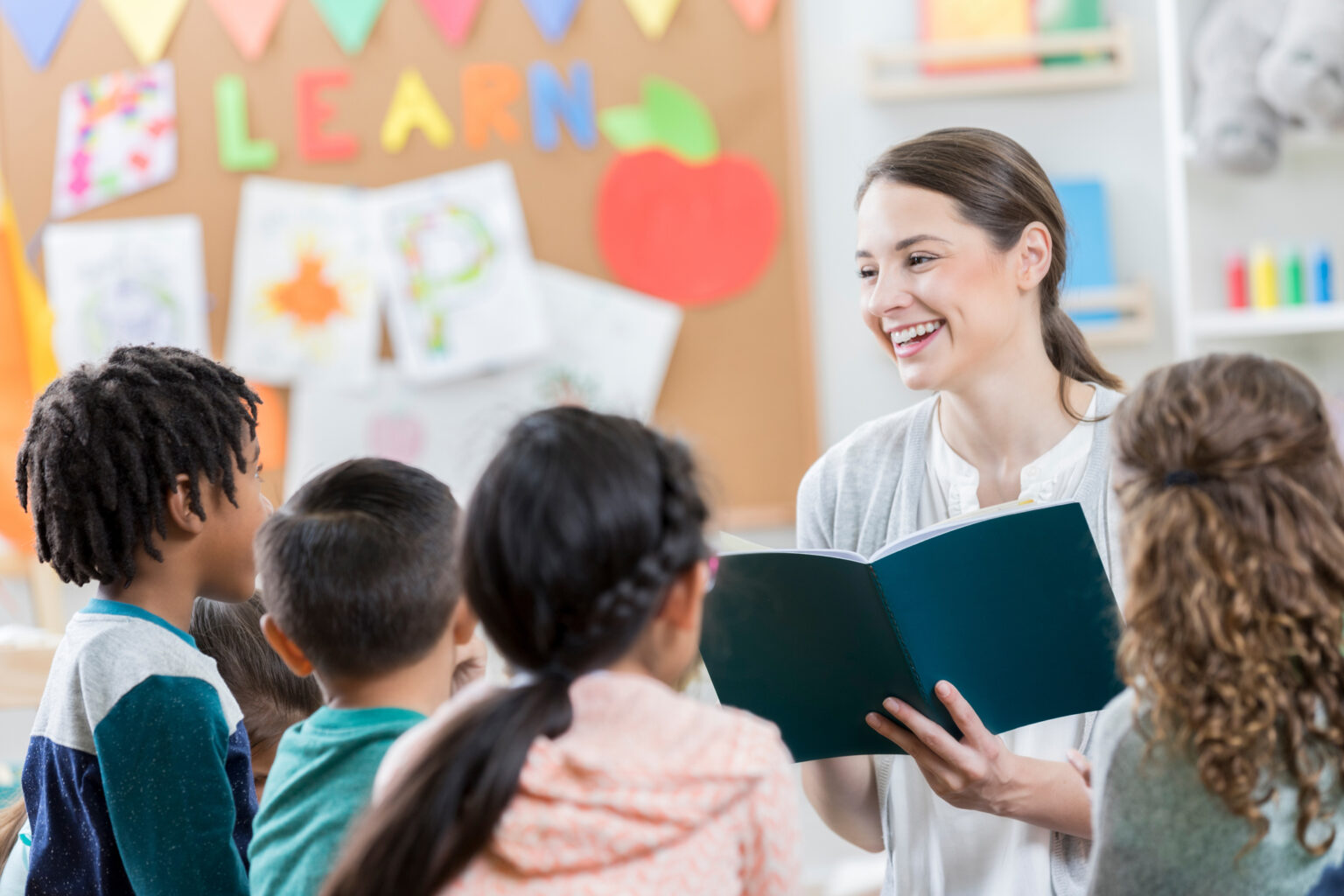 Teacher reading to elementary school classroom